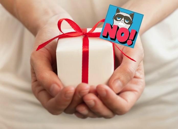 two hands cupping a small gift with a bow