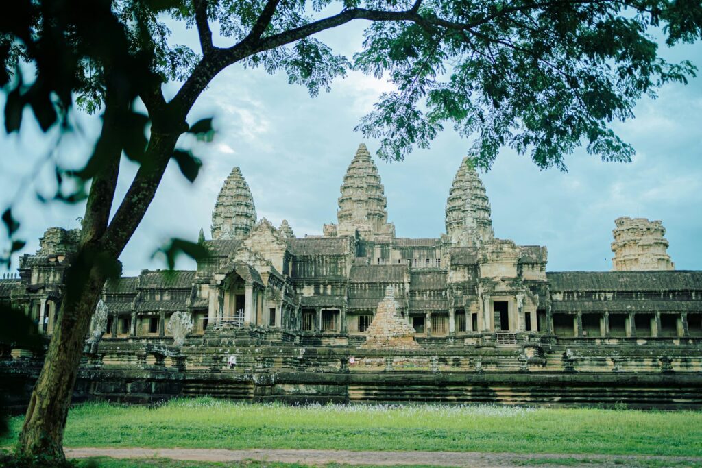 The temple of Angkor Wat in Cambodia, set against a grey sky