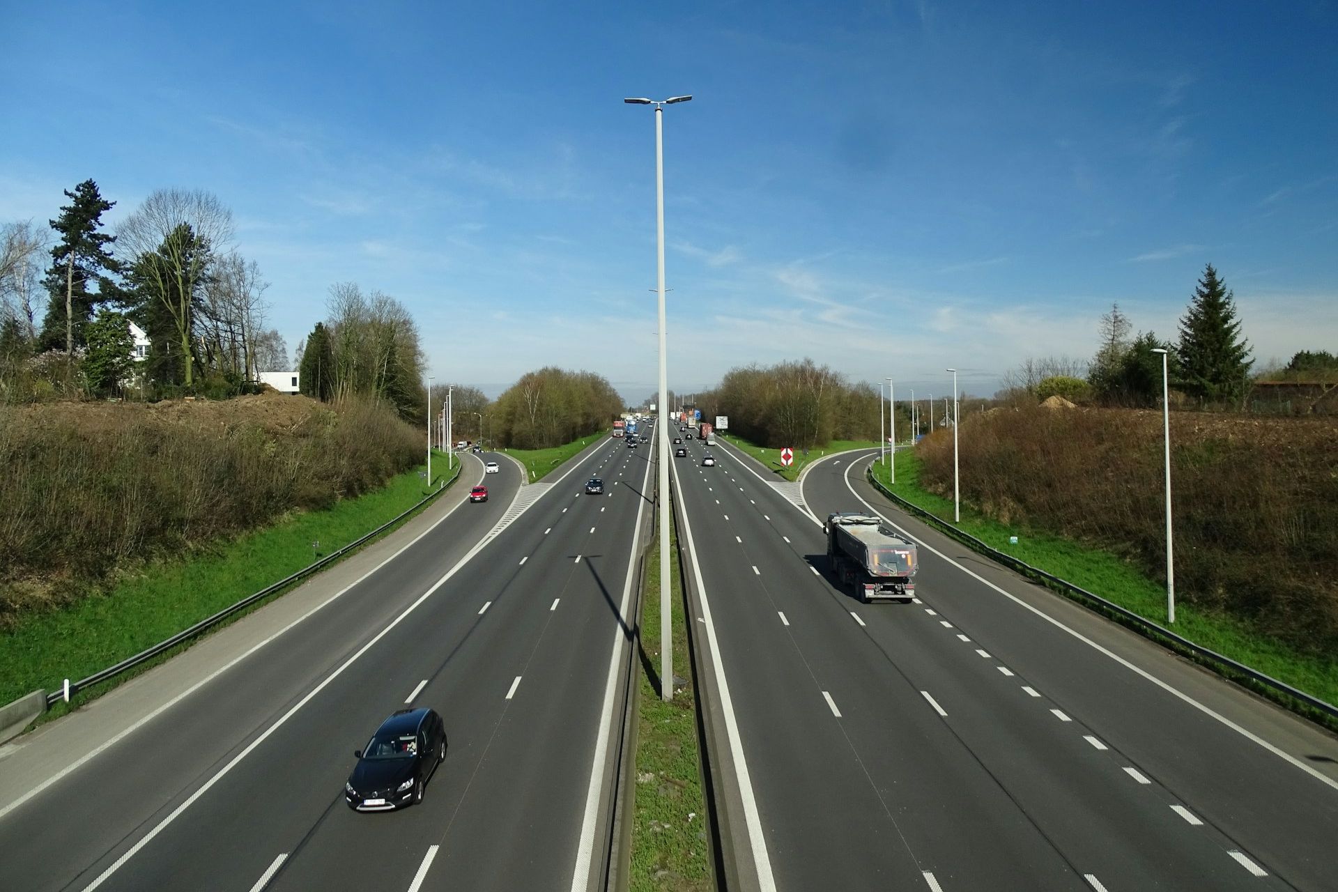 An open motorway, with a single driver occupying the middle lane