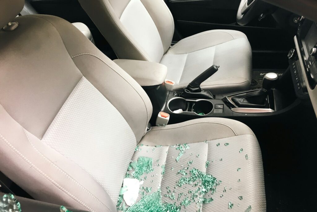 Shattered glass over a car seat